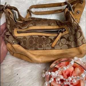 Tan damaged coach purse